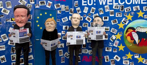 Actors dressed in EU leader face masks pose in front of a refugee message board during a demonstration in front a refugee message board outside of EU headquarters on Monday, Sept. 14, 2015. Actors dressed in EU leader face masks pose in front of a refugee message board during a demonstration in front a refugee message board outside of EU headquarters on Monday, Sept. 14, 2015. - Sputnik International