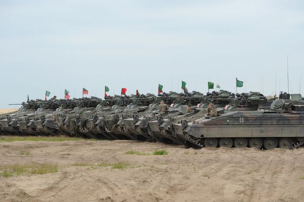 German army tanks line up during the course of the NATO Noble Jump exercise on a training range near Swietoszow Zagan, Poland, June 2015. The German military has seen an increase in deployments for exercises in Eastern Europe and on Russia's borders since the start of the Ukrainian crisis in February 2014. German army tanks line up during the course of the NATO Noble Jump exercise on a training range near Swietoszow Zagan, Poland, June 2015. The German military has seen an increase in deployments for exercises in Eastern Europe and on Russia's borders since the start of the Ukrainian crisis in February 2014. - Sputnik International