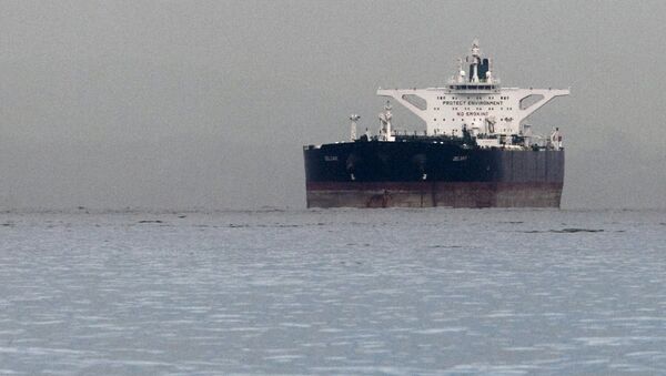 Malta-flagged Iranian crude oil supertanker Delvar is seen anchored off Singapore in this March 1, 2012 file photo - Sputnik International