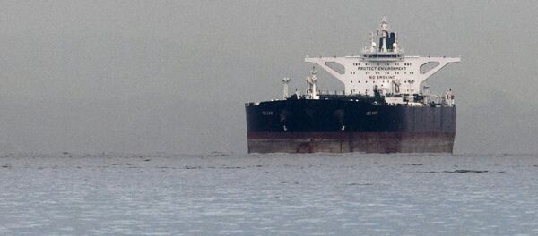 Malta-flagged Iranian crude oil supertanker Delvar is seen anchored off Singapore in this March 1, 2012 file photo - Sputnik International