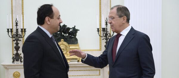 Qatari Foreign Minister Khalid Bin Mohamed al-Attiyah (left) and his Russian counterpart Sergei Lavrov talking before President Vladimir Putin's Kremlin meeting with Qatari Emir Tamim bin Hamad Al-Thani, January 18, 2016 - Sputnik International