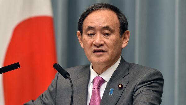 Japan's Chief Cabinet Secretary Yoshihide Suga speaks at a press conference at the prime minister's official residence in Tokyo on March 19, 2015 - Sputnik International