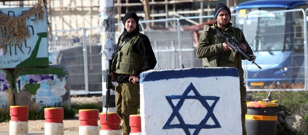 Israeli soldiers stand guard at the Gush Etzion junction in the West Bank (File) Israeli soldiers stand guard at the Gush Etzion junction in the West Bank (File) - Sputnik International