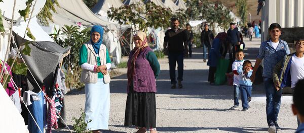 Syrian Refugees go about their daily lives at the Osmaniye refugee camp in Turkey on December 15, 2015 Syrian Refugees go about their daily lives at the Osmaniye refugee camp in Turkey on December 15, 2015 - Sputnik International
