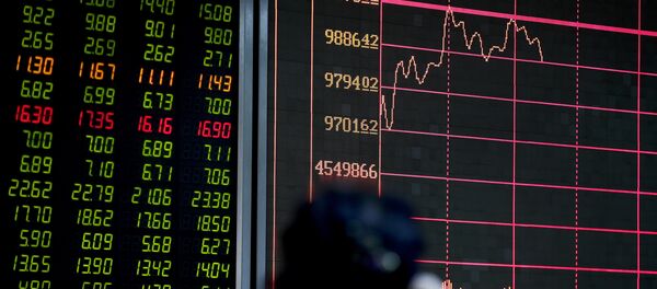 An investor looks at an electronic board displaying stock prices at a brokerage house in Beijing, Thursday, Jan. 14, 2016 An investor looks at an electronic board displaying stock prices at a brokerage house in Beijing, Thursday, Jan. 14, 2016 - Sputnik International