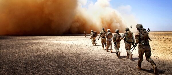 U.S. Marines assigned to Georgian Liaison Team-9 and Georgian Army soldiers assigned to the 33rd Light Infantry Battalion make their way to the extraction point during Operation Northern Lion II in Helmand province, Afghanistan, July 3, 2013 - Sputnik International