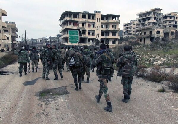 Syrian government troops walk inside the key town of Salma in Latakia province, Syria Syrian government troops walk inside the key town of Salma in Latakia province, Syria - Sputnik International