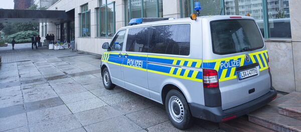 A police car stands in front of the initial reception center for asylum seekers in Halle/Saale, Germany, Friday, Oct. 16, 2015 A police car stands in front of the initial reception center for asylum seekers in Halle/Saale, Germany, Friday, Oct. 16, 2015 - Sputnik International