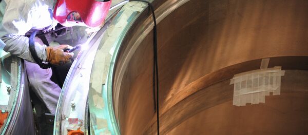 A welding operator at the assembling of a reactor in the 'clean area' A welding operator at the assembling of a reactor in the 'clean area' - Sputnik International