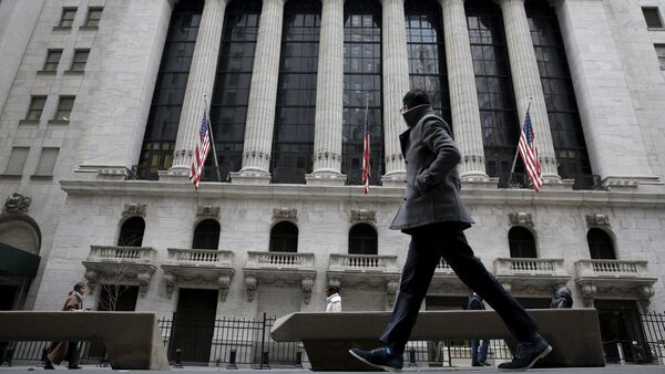 A man passes by the New York Stock Exchange in New York's financial district. File photo. - Sputnik International
