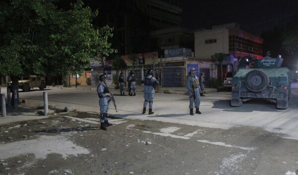 Afghan security forces inspect the site of a Park Palace Hotel attack by Taliban militants, in Kabul, Afghanistan, Wednesday, May 13, 2015 Afghan security forces inspect the site of a Park Palace Hotel attack by Taliban militants, in Kabul, Afghanistan, Wednesday, May 13, 2015 - Sputnik International