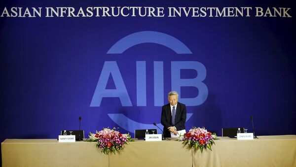 President of Asian Infrastructure Investment Bank (AIIB) Jin Liqun greets to journalists as he arrives at a news conference in Beijing January 17, 2016 - Sputnik International