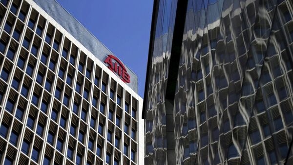 The logo of Asian Infrastructure Investment Bank (AIIB) is seen at its headquarter building in Beijing January 17, 2016 - Sputnik International