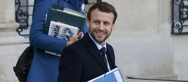 French Economy Minister Emmanuel Macron leaves after the first weekly cabinet meeting of the year at the Elysee Palace in Paris. French Economy Minister Emmanuel Macron leaves after the first weekly cabinet meeting of the year at the Elysee Palace in Paris. - Sputnik International