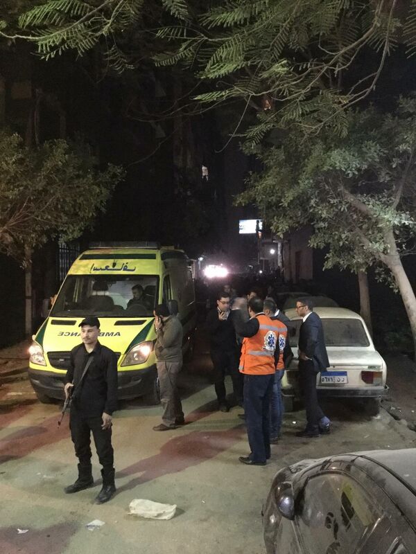 First responders and security personnel stand outside of a Cairo apartment where a bomb exploded. First responders and security personnel stand outside of a Cairo apartment where a bomb exploded. - Sputnik International