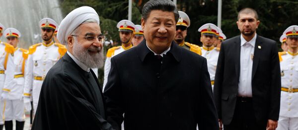 Iranian President Hassan Rouhani shakes hands with Chinese President Xi Jinping (R) during a welcoming ceremony on January 23, 2016 in the capital Tehran. - Sputnik International