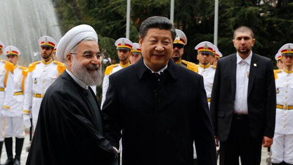 Iranian President Hassan Rouhani shakes hands with Chinese President Xi Jinping (R) during a welcoming ceremony on January 23, 2016 in the capital Tehran. - Sputnik International