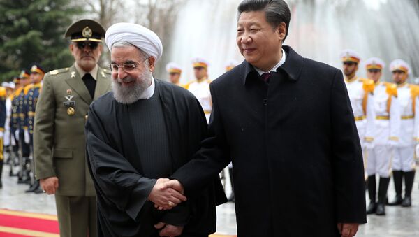 Chinese President Xi Jinping, right, shakes hands with Iranian President Hassan Rouhani in an official arrival ceremony, at the Saadabad Palace in Tehran, Iran, Saturday, Jan. 23, 2016. - Sputnik International