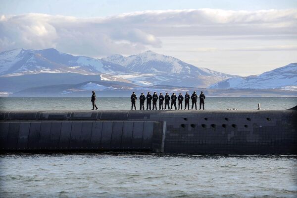 British Navy personnel stand atop the Trident Nuclear Submarine, HMS Victorious, on patrol off the west coast of Scotland British Navy personnel stand atop the Trident Nuclear Submarine, HMS Victorious, on patrol off the west coast of Scotland - Sputnik International