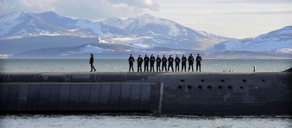 British Navy personnel stand atop the Trident Nuclear Submarine, HMS Victorious, on patrol off the west coast of Scotland British Navy personnel stand atop the Trident Nuclear Submarine, HMS Victorious, on patrol off the west coast of Scotland - Sputnik International