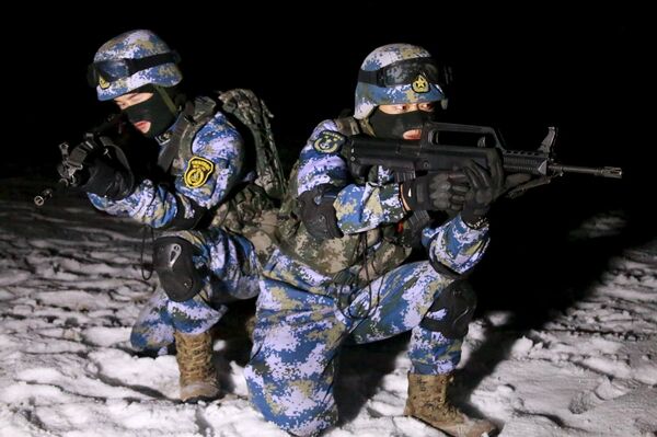 Soldiers of the People's Liberation Army (PLA) Marine Corps are seen in training at a military training base in Xinjiang Uighur Autonomous Region. The region has faced a string of attacks by separatist militants affiliated with Islamic extremists in recent years. Soldiers of the People's Liberation Army (PLA) Marine Corps are seen in training at a military training base in Xinjiang Uighur Autonomous Region. The region has faced a string of attacks by separatist militants affiliated with Islamic extremists in recent years. - Sputnik International