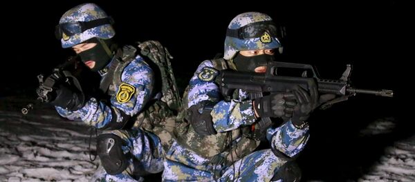 Soldiers of the People's Liberation Army (PLA) Marine Corps are seen in training at a military training base in Xinjiang Uighur Autonomous Region. The region has faced a string of attacks by separatist militants affiliated with Islamic extremists in recent years. Soldiers of the People's Liberation Army (PLA) Marine Corps are seen in training at a military training base in Xinjiang Uighur Autonomous Region. The region has faced a string of attacks by separatist militants affiliated with Islamic extremists in recent years. - Sputnik International