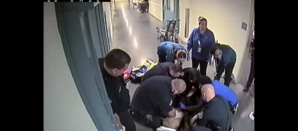 Screenshot of a video from a jail in Denver showing a police response to an inmate choking to death Screenshot of a video from a jail in Denver showing a police response to an inmate choking to death - Sputnik International