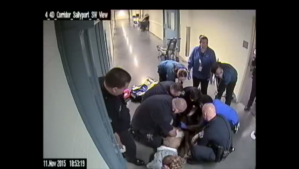 Screenshot of a video from a jail in Denver showing a police response to an inmate choking to death - Sputnik International