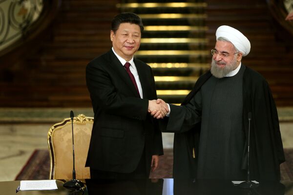 Iranian President Hassan Rouhani, right, and his Chinese counterpart Xi Jinping shake hands at the conclusion of their joint press conference at the Saadabad Palace in Tehran, Iran, Saturday, Jan. 23, 2016 Iranian President Hassan Rouhani, right, and his Chinese counterpart Xi Jinping shake hands at the conclusion of their joint press conference at the Saadabad Palace in Tehran, Iran, Saturday, Jan. 23, 2016 - Sputnik International