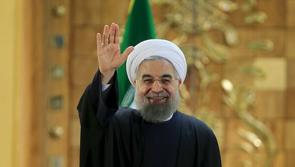 Iranian President Hassan Rouhani waves during a news conference in Tehran, Iran January 17, 2016. - Sputnik International