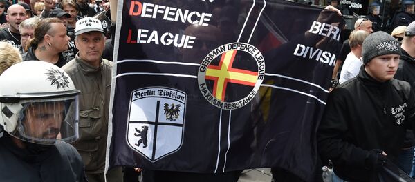 Right-extremists and hooligans take part in a rally of the initiative Widerstand Ost/West (Resistance East/West, WOW), a union of right-wing nationalists, Islamophobes and hooligans, on June 20, 2015 in Frankfurt am Main, western Germany Right-extremists and hooligans take part in a rally of the initiative Widerstand Ost/West (Resistance East/West, WOW), a union of right-wing nationalists, Islamophobes and hooligans, on June 20, 2015 in Frankfurt am Main, western Germany - Sputnik International
