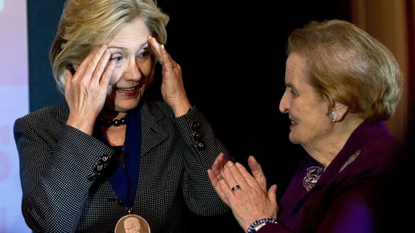 Former US Secretary of State Hillary Clinton (L) speaks with former Secretary of State Madeleine Albright after receiving the 2013 Lantos Human Rights Prize during a ceremony on Capitol Hill in Washington on December 6, 2013 - Sputnik International