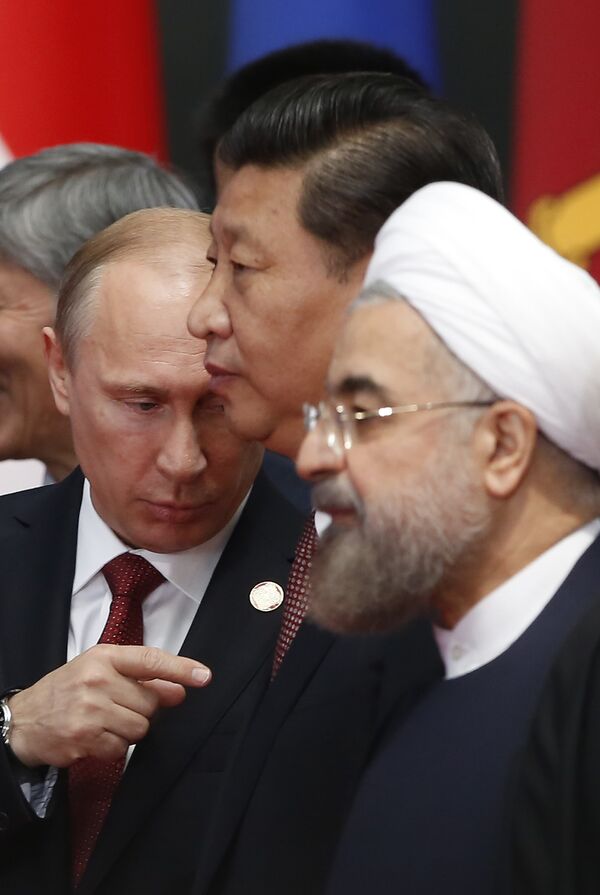 Russian President Vladimir Putin (L), Chinese President Xi Jinping (C) and Iran's President Hassan Rouhani attend the Expo Center before the opening ceremony at the Expo Center at the fourth Conference on Interaction and Confidence Building Measures in Asia (CICA) summit in Shanghai on May 21, 2014 Russian President Vladimir Putin (L), Chinese President Xi Jinping (C) and Iran's President Hassan Rouhani attend the Expo Center before the opening ceremony at the Expo Center at the fourth Conference on Interaction and Confidence Building Measures in Asia (CICA) summit in Shanghai on May 21, 2014 - Sputnik International