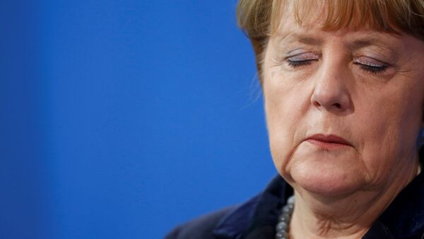 German Chancellor Angela Merkel listens during a joint news conference with Romania's Prime Minister Dacian Ciolos (not pictured) at the Chancellery in Berlin, Germany, January 7, 2016. - Sputnik International
