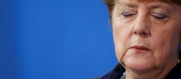 German Chancellor Angela Merkel listens during a joint news conference with Romania's Prime Minister Dacian Ciolos (not pictured) at the Chancellery in Berlin, Germany, January 7, 2016. - Sputnik International