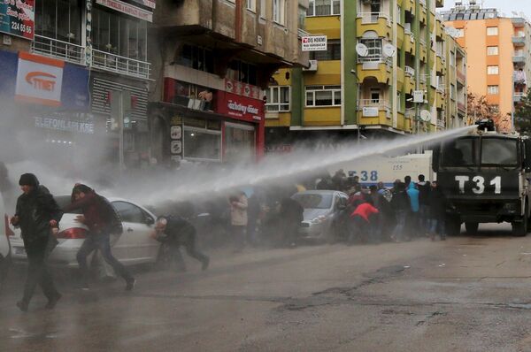Turkish riot police use a water cannon to disperse Kurdish demonstrators during a protest against a curfew in Sur district and security operations in the region, in the southeastern city of Diyarbakir, Turkey January 17, 2016 Turkish riot police use a water cannon to disperse Kurdish demonstrators during a protest against a curfew in Sur district and security operations in the region, in the southeastern city of Diyarbakir, Turkey January 17, 2016 - Sputnik International