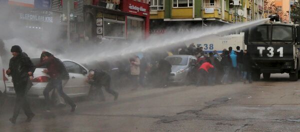 Turkish riot police use a water cannon to disperse Kurdish demonstrators during a protest against a curfew in Sur district and security operations in the region, in the southeastern city of Diyarbakir, Turkey January 17, 2016 Turkish riot police use a water cannon to disperse Kurdish demonstrators during a protest against a curfew in Sur district and security operations in the region, in the southeastern city of Diyarbakir, Turkey January 17, 2016 - Sputnik International