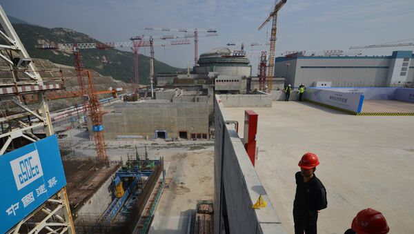 Workers wait for French Prime Minister Jean-Marc Ayrault to arrive at the joint Sino-French Taishan Nuclear Power Station outside Taishan City in Guandong province on December 8, 2013 - Sputnik International