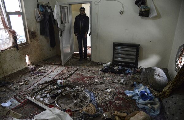 A man stands in the room of a house after it was hit by a mortar during clashes with Turkish police at the Sur district in Diyarbakir, southeastern Turkey, on January 3, 2016 A man stands in the room of a house after it was hit by a mortar during clashes with Turkish police at the Sur district in Diyarbakir, southeastern Turkey, on January 3, 2016 - Sputnik International