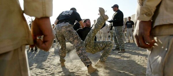 Iraqi Army Scorpions Forces personnel (C) are trained in hand-to-hand combat by US military personnel in Hilla, 120 kms south of Baghdad Iraqi Army Scorpions Forces personnel (C) are trained in hand-to-hand combat by US military personnel in Hilla, 120 kms south of Baghdad - Sputnik International