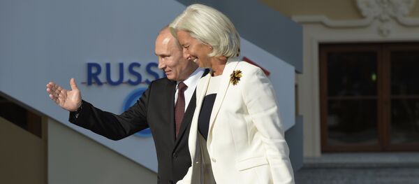 Russia’s President Vladimir Putin (L) welcomes International Monetary Fund (IMF) Managing Director Christine Lagarde at the start of the G20 summit on September 5, 2013 in Saint Petersburg Russia’s President Vladimir Putin (L) welcomes International Monetary Fund (IMF) Managing Director Christine Lagarde at the start of the G20 summit on September 5, 2013 in Saint Petersburg - Sputnik International