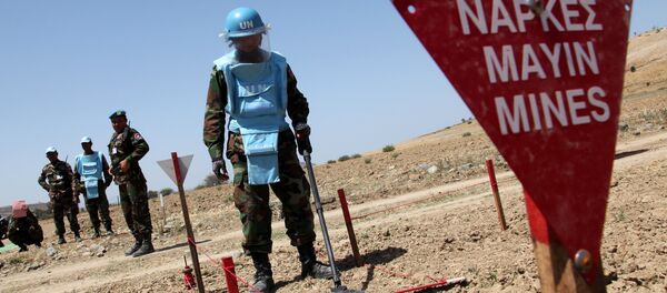 An UNIFIL's Cambodian mine expert demonstrates his work on April 23, 2014 in the UN-controlled buffer zone, where demining operations are being conducted under the auspices of the United Nations Peacekeeping Force in Cyprus (UNFICYP), near the village of Mammari An UNIFIL's Cambodian mine expert demonstrates his work on April 23, 2014 in the UN-controlled buffer zone, where demining operations are being conducted under the auspices of the United Nations Peacekeeping Force in Cyprus (UNFICYP), near the village of Mammari - Sputnik International