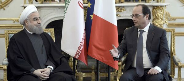 French President Francois Hollande (R) meets Iran's President Hassan Rouhani at the Elysee Palace in Paris, France, January 28, 2016 - Sputnik International