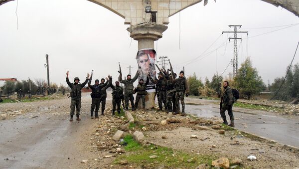 Syrian pro-government forces celebrate on a street in the town of Sheikh Miskeen in southern Daraa province on January 26, 2016 after they retook the strategic town from rebel forces - Sputnik International