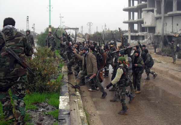 Syrian pro-government forces celebrate on a street in the town of Sheikh Miskeen in southern Daraa province on January 26, 2016 after they retook the strategic town from terrorists Syrian pro-government forces celebrate on a street in the town of Sheikh Miskeen in southern Daraa province on January 26, 2016 after they retook the strategic town from terrorists - Sputnik International