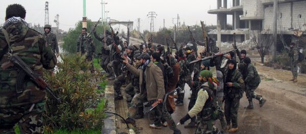 Syrian pro-government forces celebrate on a street in the town of Sheikh Miskeen in southern Daraa province on January 26, 2016 after they retook the strategic town from rebel forces Syrian pro-government forces celebrate on a street in the town of Sheikh Miskeen in southern Daraa province on January 26, 2016 after they retook the strategic town from rebel forces - Sputnik International