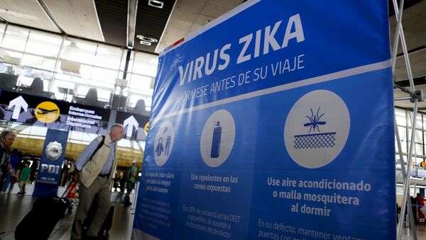A banner is seen during an information campaign on Zika virus by the Chilean Health Ministry at the departures area of Santiago's international airport, Chile, January 28, 2016 - Sputnik International