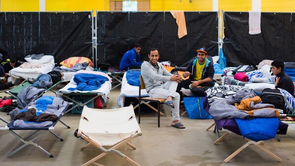 Refugees are seen in their temporary housing in a former hardware store in Hamburg, northern Germany. - Sputnik International