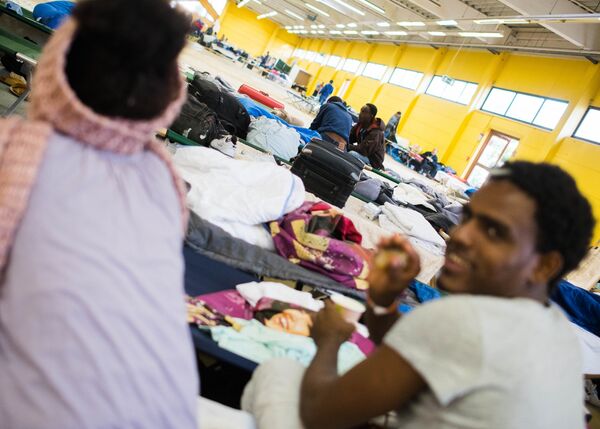 Refugees are seen in their temporary housing in a former hardware store in Hamburg, northern Germany Refugees are seen in their temporary housing in a former hardware store in Hamburg, northern Germany - Sputnik International