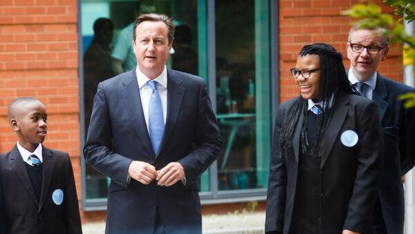 Britain's Prime Minister David Cameron (2-L) and Secretary of State for Education Michael Gove (R) walk with students during the opening of the Perry Beeches III Free School in Birmingham on September 3, 2013 - Sputnik International